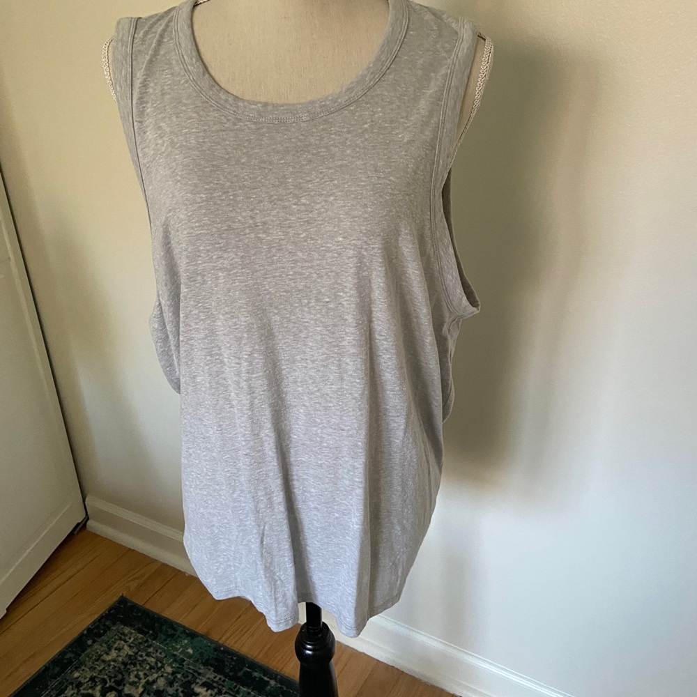 Sleeveless top, runs small.  Prob more like XL